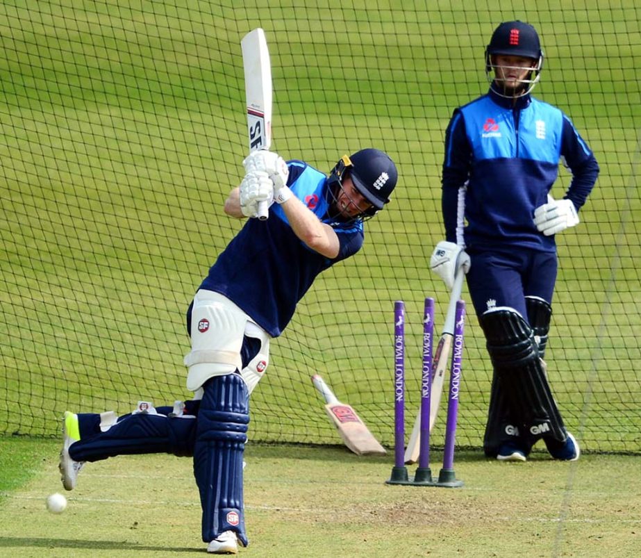 Eoin Morgan practises while Ben Duckett watches on at Bristol on Thursday.