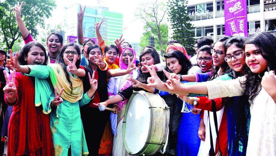 Students of Uttara Rajuk Model School and College rejoicing after getting their SSC results on Thursday.