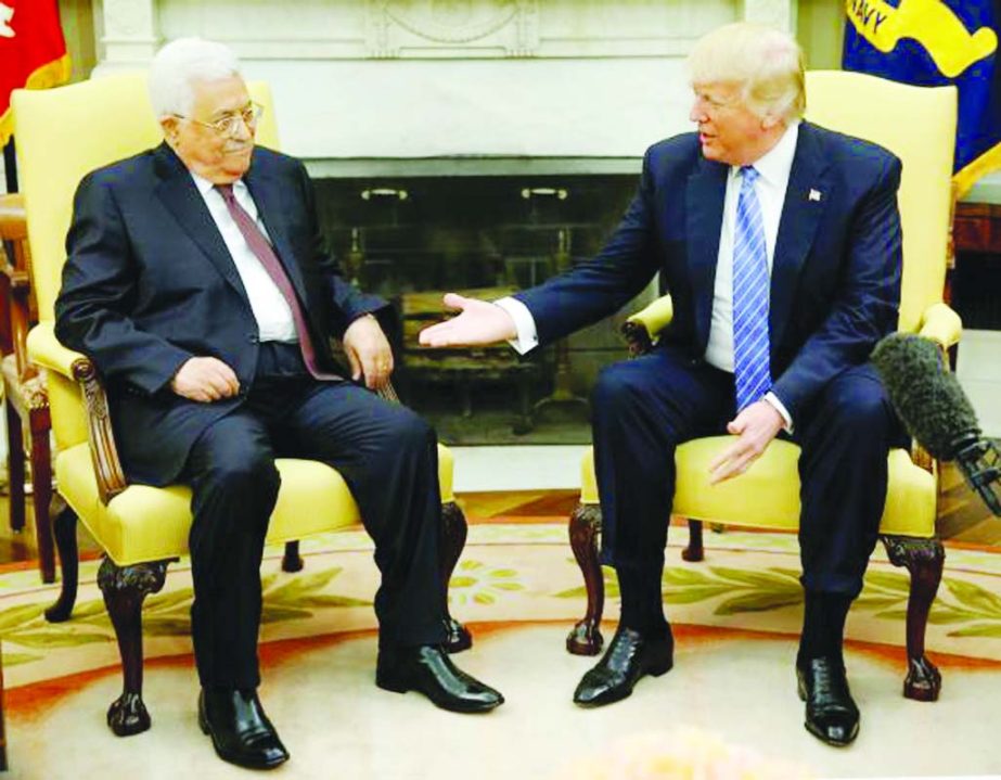 U.S. President Donald Trump welcomes Palestinian President Mahmoud Abbas in the Oval Office at the White House in Washington, on Wednesday.