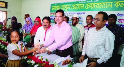 TRISHAL (Mymensingh): Md Khalilur Rahman, DC, Mymensingh distributing crests at the scholarship giving ceremony among the meritorious students at Pourashava Auditorium organised by Abdul Hossain Chairman Kalyan Trust as Chief Guest on Tuesday.