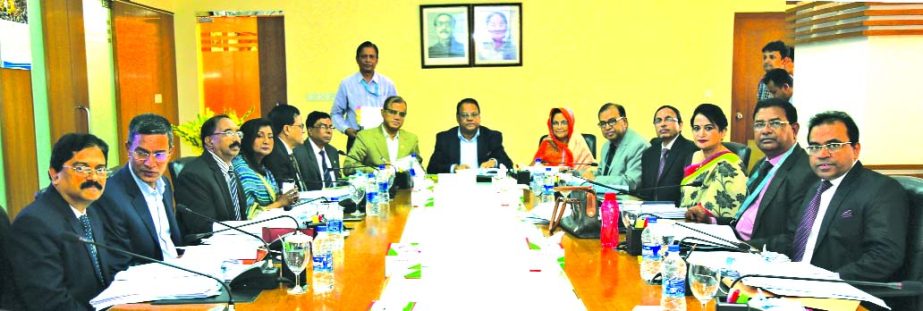 Shaikh Md Wahid-Uz-Zaman, Chairman of Janata Bank Limited, presiding over its Board of Directors Meeting at its head office in the city recently. The meeting approved its Financial Statement-2016. Md Abdus Salam, Managing Director, Manik Chandra Dey, Khon