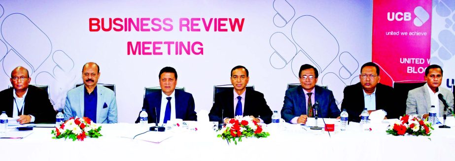 Muhammed Ali, Managing Director of UCB, presiding over the Business Review Meeting of Dhaka Zone at its Learning and Development Center in the city on Saturday. M Shahidul Islam, Mirza Mahmud Rafiqur Rahman, AE Abdul Muhaimen and Md Tariqul Azam, Additio