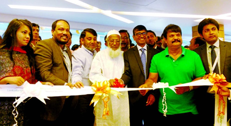 Khwaja Shahriar, Acting Managing Director of LankaBangla Finance Limited, inaugurating its 22nd Branch at Goneshtola in Dinajpur recently. Other high officials of the company and local elites were present.