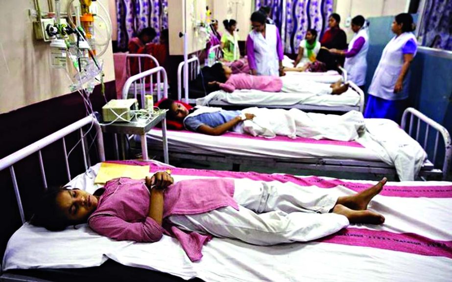 Children lie on hospital beds as they receive treatment after complaining of breathlessness and eye irritation following a gas leak from a fuel tanker in New Delhi.
