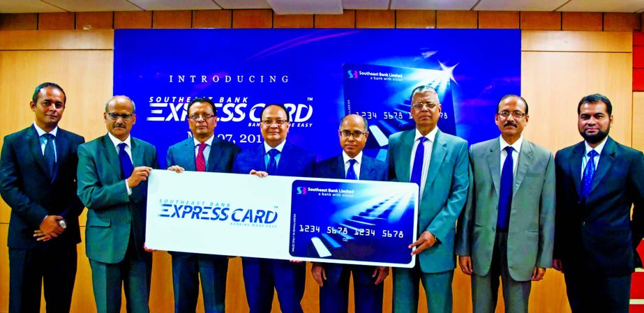 M Kamal Hossain, Managing Director (CC) of Southeast Bank Limited, inaugurating its "Southeast Bank Express Card" at the bank's head office in the city on Sunday. Mohammed Gofran, SM Mainuddin Chowdhury, Muhammad Shahjahan, AKM Nurul Alam, Additional M