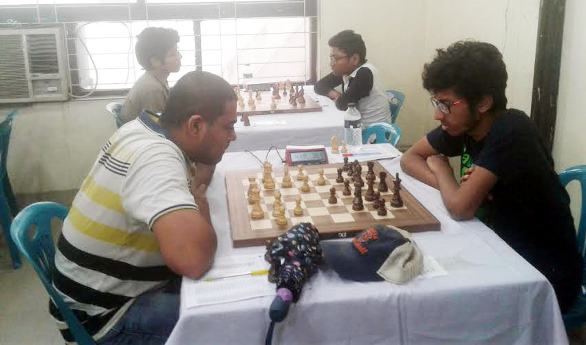 CM Ikramul Haq Siam (left) of Pabna playing against Akib Jawad of Chittagong in the 4th round match of the 37th National Junior Chess Championship at Bangladesh Chess Federation hall-room on Sunday.