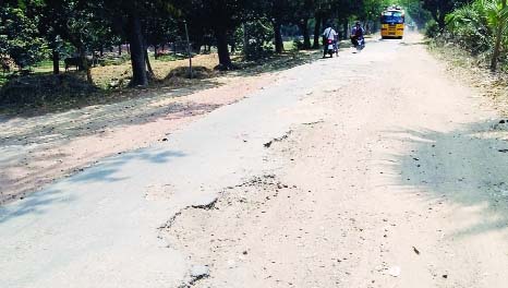 SAPAHAR (Naogaon): Dilapidated Khanjanpur Road in Sapahar Upazila needs immediate repair as big potholes have been developed hampering vehicles movement. This snap was taken on Sunday. Photo: Kamrul Islam