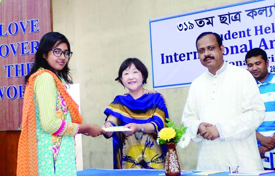 GAZIPUR: Mrs Higashimura Mariko, Chairperson and Md Azizul Bari, Executive Director of International Angel Association,a voluntary organisation of Japan distributing stipend among the university students at Konabari recently.