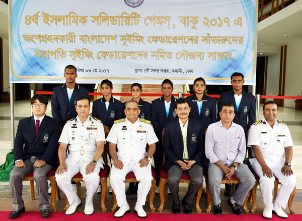 A 6-member Bangladesh National Swimming team, who will take part in 4th Islamic Solidarity Games pose for photo with Naval Chief and Swimming Federation President Admiral Nijamuddin Ahamed at the Navy Headquarter on Monday.