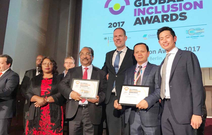 Md. Sabur Khan, Chairman of Daffodil International University and SK Sur Chowdhury, Deputy Governor of Bangladesh Bank pose for a photograph with Child and Youth Finance International and German Federal Ministry for Economic Cooperation and Development