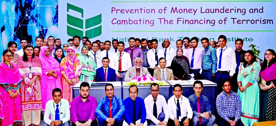 Shah Syed Abdul Bari, DMD of National Bank Limited, poses with the participants of workshop on "Prevention of Money Laundering and Combating the Financing of Terrorism" at its training institute in the city recently. Abdul Wahab, SVP and officers of For