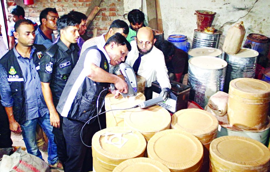 RAB mobile team led by a magistrate fines Taka Eight lakh and sentenced two traders for preserving spurious chemicals at the godown in city's Mitford area on Tuesday.