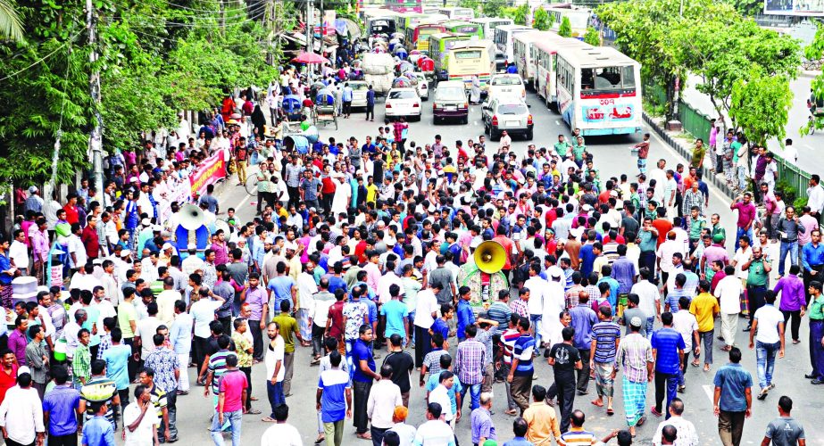 Bangladesh Hawkers' Union blockading the road in front of the Jatiya Press Club on Tuesday demanding to implement their grievances and stop harassment of hawkers by the City Corporation authority.