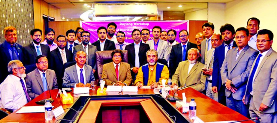 Arastoo Khan, Chairman of Islamic Banks Consultative Forum and Islami Bank Bangladesh Limited, poses with the participants of a day-long workshop on "Shariah Principles of Distribution of Profit to Participating Fund: Global & National perspective" at B