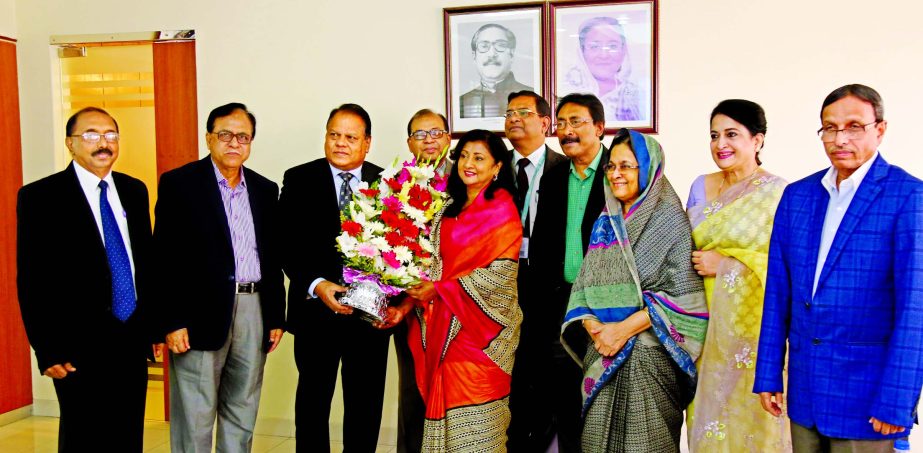 Shaikh Md. Wahid-uz-Zaman, Chairman of Janata Bank Limited, congratulating to Luna Samsuddoha, Director of the bank for achieving Bangladesh Business Award-2017 on Thurusday. Khondker Sabera Islam, Md. Mofazzal Husain, A.K. Fazlul Ahad, Selima Ahmad, Moha