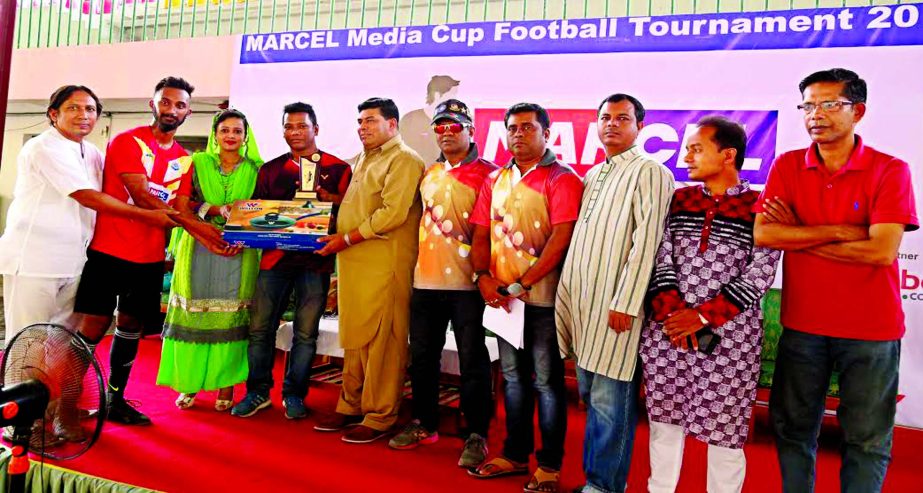 Shahriar of Dhaka Tribune receiving the Man of the Match award of the Marcel-BSJC Media Cup Football Tournament from FM Iqbal Bin Anwar Dawn, Operative Director and Head of Sports & Welfare Department of Walton Group at the Shaheed (Captain) M Mansur Ali