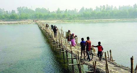NAOGAON: An iron bridge is needed over Atrai River immediately as 20 thousand people of five unions are using this bridge. This picture was taken yesterday.