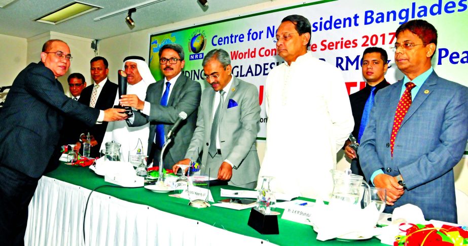 State Minister for Foreign Affairs Md. Shahriar Alam MP, handing over the Financial Branding award to Habibur Rahman, Deputy Managing Director of Prime Bank at inaugural ceremony of world conference series 2017 at a city hotel recently.