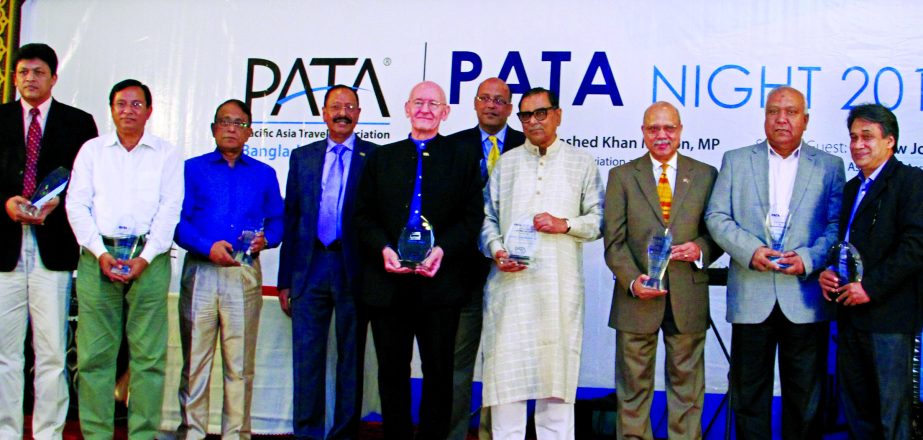 Civil Aviation and Tourism Minister Rashed Khan Menon, MP, poses with the participants of "PATA Night 2017" at Dhaka Regency on Saturday. Pacific Asia Travel Association, Bangladesh Chapter organized the night for "Celebrating the best in the Banglades