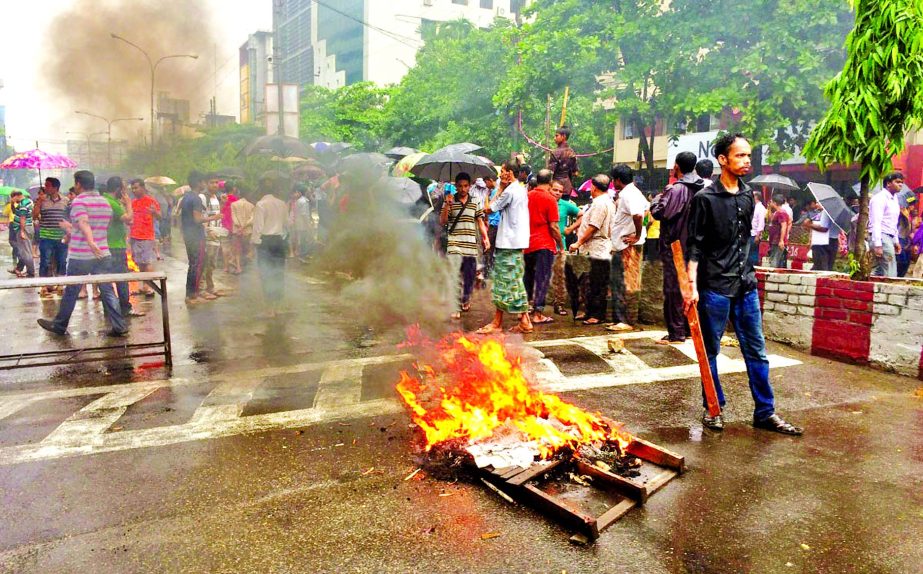 People of local Hindu community blocked road near Barik Building intersection protesting vandalizing of some idols by the miscreants at Gosaildanga Shib Temple in Agrabad area of Chittagong on Sunday.