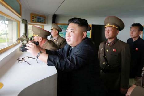 North Korean leader Kim Jong Un inspects the defence detachment on Jangjae Islet and the Hero Defence Detachment on Mu Islet located in the southernmost part of the waters off the southwest front, in this undated photo released by North Korea's Korean Ce