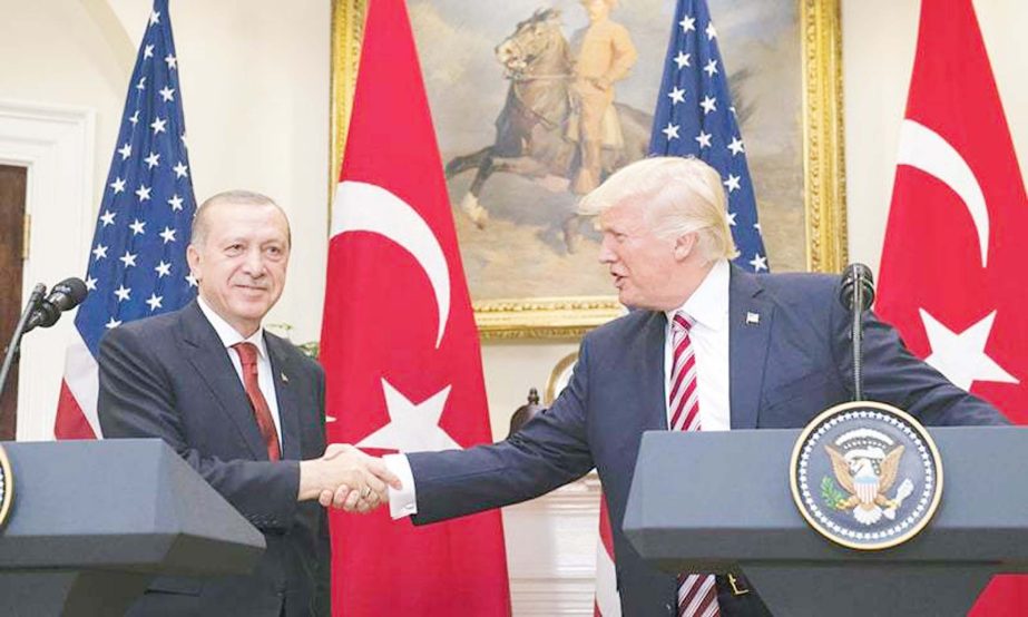 US President Donald Trump shaking hands with Turkish President Recep Tayyip Erdogan after speaking to the press at the White House on Tuesday.