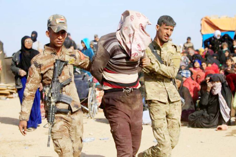 Iraqi special operations forces arresting a person suspected of belonging to ISIS in western Mosul, Iraq.
