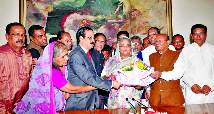 Leaders of Bangladesh Awami League and its associate bodies greeting Prime Minister Sheikh Hasina at Ganobhaban on the occasion of her 37th Homecoming Day yesterday morning.