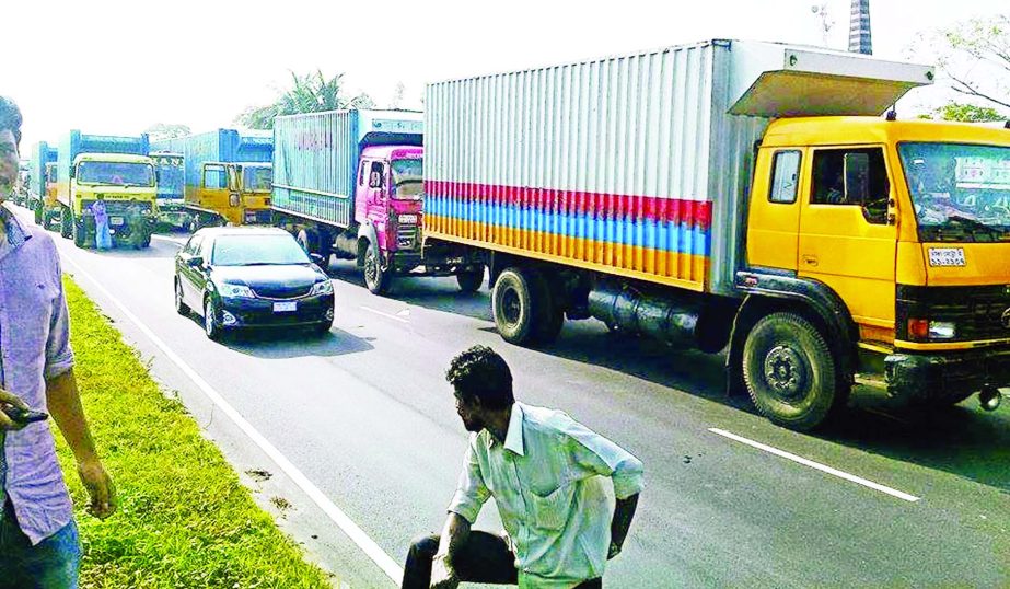 Vehicles mostly covered vans, trucks and buses got stuck in sudden gridlocks on Dhaka-Chittagong highway creating a long tailback at Fazilpur in Feni on Thursday causing sufferings to commuters for hours.