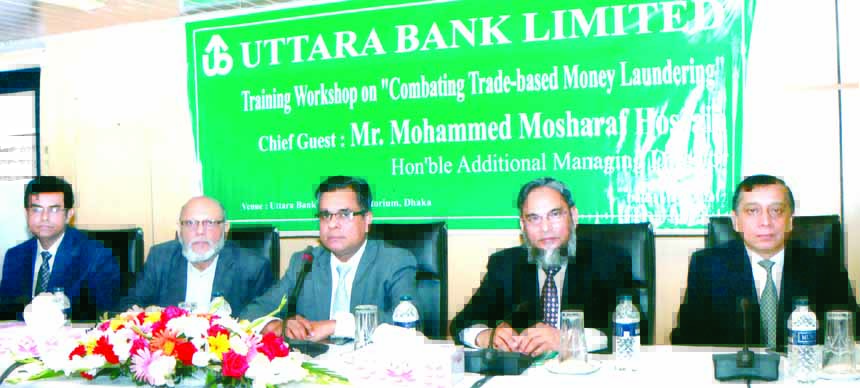 Mohammed Mosharaf Hossain, Additonal Managing Director of Uttara Bank Limited, presiding over a daylong workshop on "Combating Trade-based Money Laundering" at the bank head office in the city recently. Syed Shaikhul Imam, GM, Sultan Ahmed and Md Abdul
