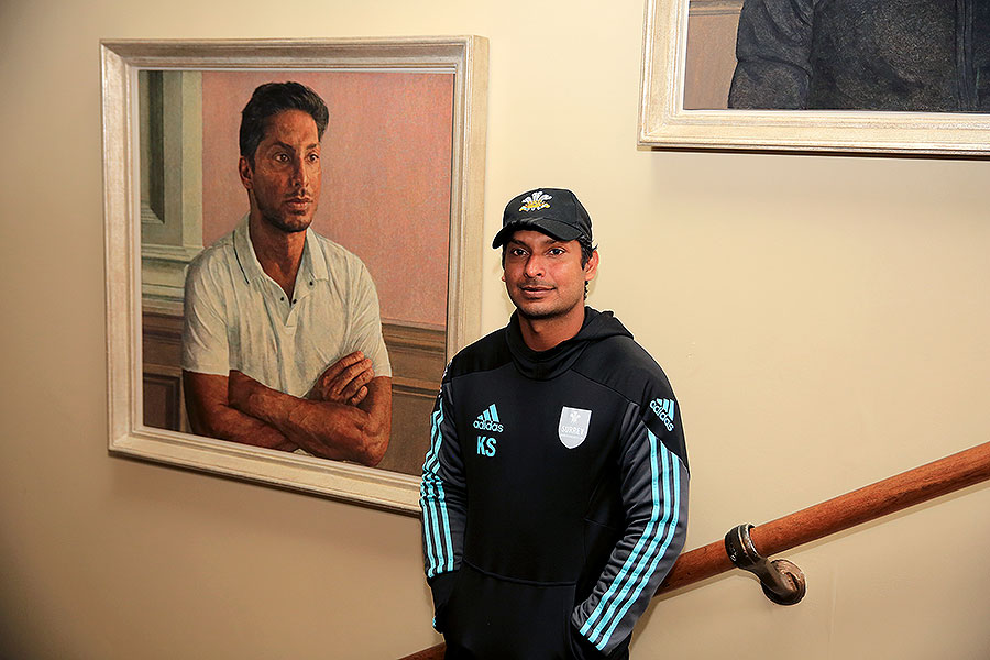 Kumar Sangakkara poses in front of his newly unveiled portrait in the Lord's Pavilion on Thursday.