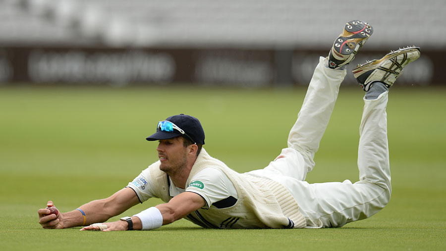 Steven Finn made good ground for a catch during the Specsavers County Championship, Division One match between Middlesex and Surrey at Lord's on Saturday.