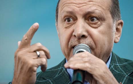 Turkish President Tayyip Erdogan, accompanied by his wife Emine Erdogan, greets members of his party during the Extraordinary Congress of the ruling AK Party (AKP) in Ankara.