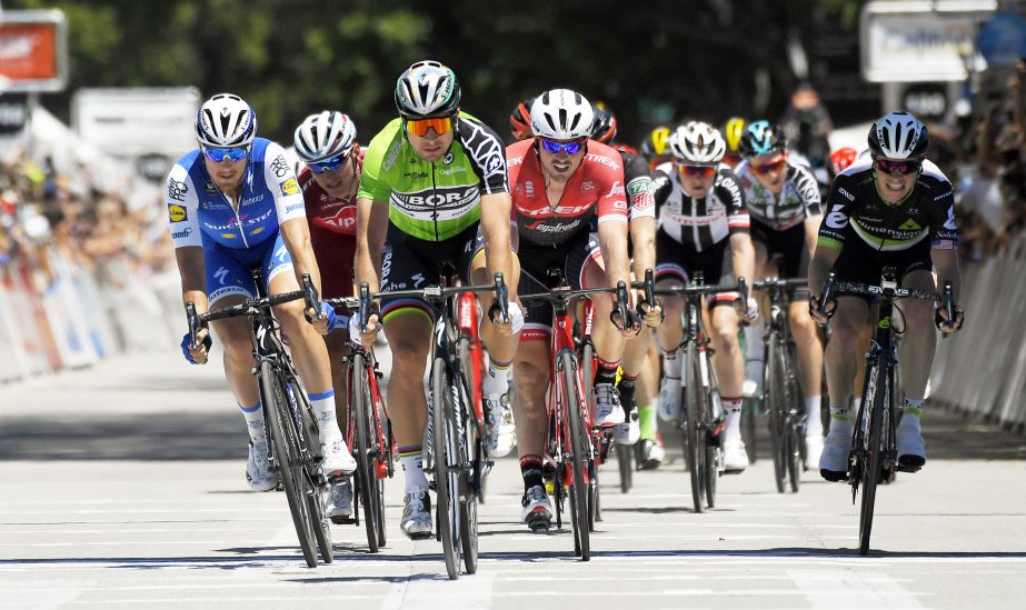 Peter Sagan (third from left) of Slovakia crosses the finish line as he wins the sprint portion of the Amgen Tour of California cycling race, on Saturday in Pasadena, Calif.