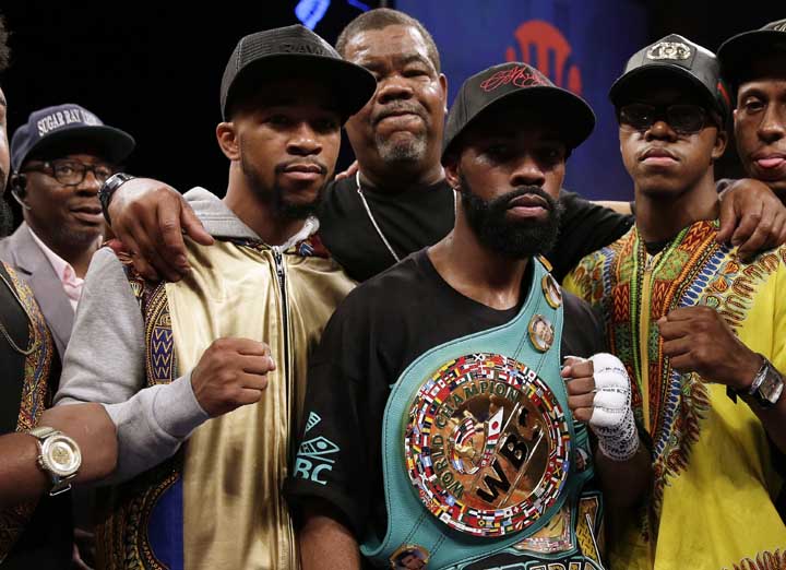 Gary Russell Jr. (center) celebrates with his team after winning the WBC featherweight title fight against Oscar Escandon in Oxon Hill, Md on Saturday.