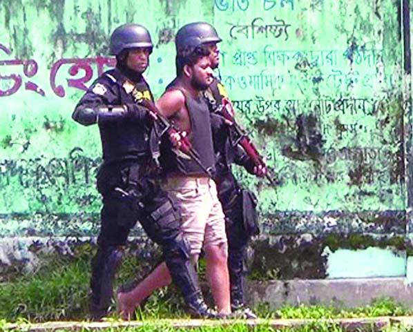 A Dhaka University student, suspected to be a militant, surrendered to elite force RAB from a house which was cordoned off by the forces at Gabtali in Narsingdi upazila on Sunday morning.