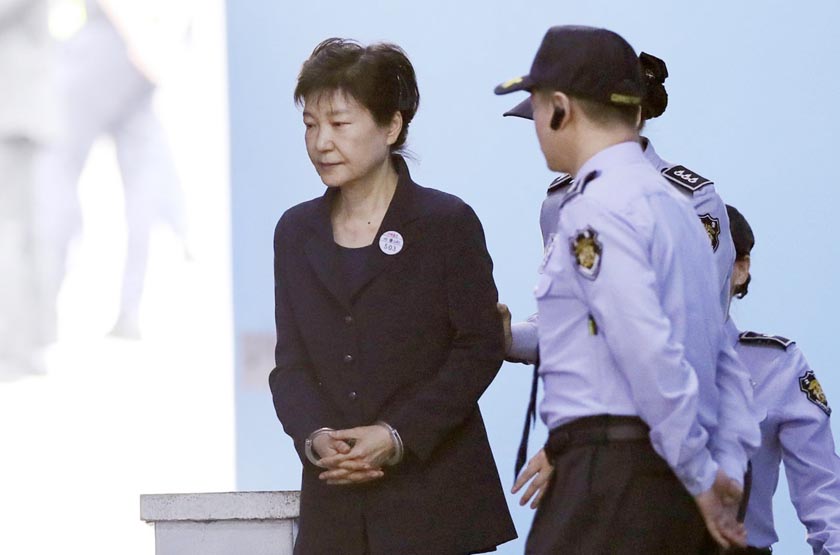 Former South Korean President Park Geun-hye leaves after her trial at the Seoul Central District Court in Seoul on Tuesday.