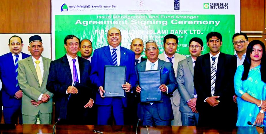 Syed Waseque Md Ali, Managing Director, First Security Islami Bank Limited, Mohammad Samsul Haque, Managing Director, Asian Tiger Capital Partners Investments Limited and Mohammad Sarwar Hossain, Managing Director of Roots Investment Limited poses after s