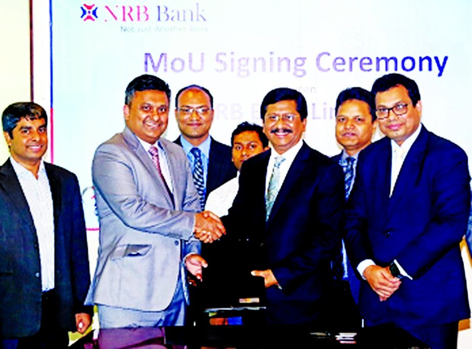 Md Mehmood Husain, Managing Director of NRB Bank Limited and Ashraful Alam, Chief Operating Officer of Aarong, exchanging agreement documents at the bank's head office in the city on Tuesday. Under the deal, Credit Cardholders of the bank will enjoy 15pc