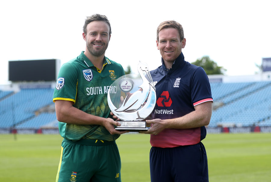 AB de Villiers and Eoin Morgan pose with the series trophy at Headingley on Tuesday.