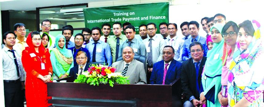 Syed Waseque Md. Ali, Managing Director of First Security Islami Bank Ltd, poses with the participants of a training program on 'International Trade Payment and Finance'at the bank's Training Institute. Md. Ataur Rahman, Principal of Training Institute