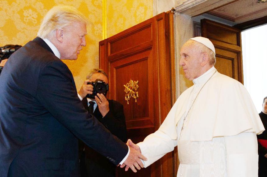 Pope Francis shakes hands with US President Donald Trump during a private audience at the Vatican.