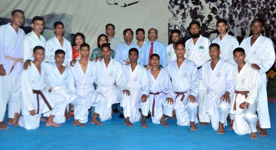 The participants of the day-long karate training workshop with the chief guest Senior Secretary of the Ministry of Public Administration and President of Bangladesh Karate Federation (BKF) Dr Md Mozammel Haque Khan and the other officials of BKF pose for