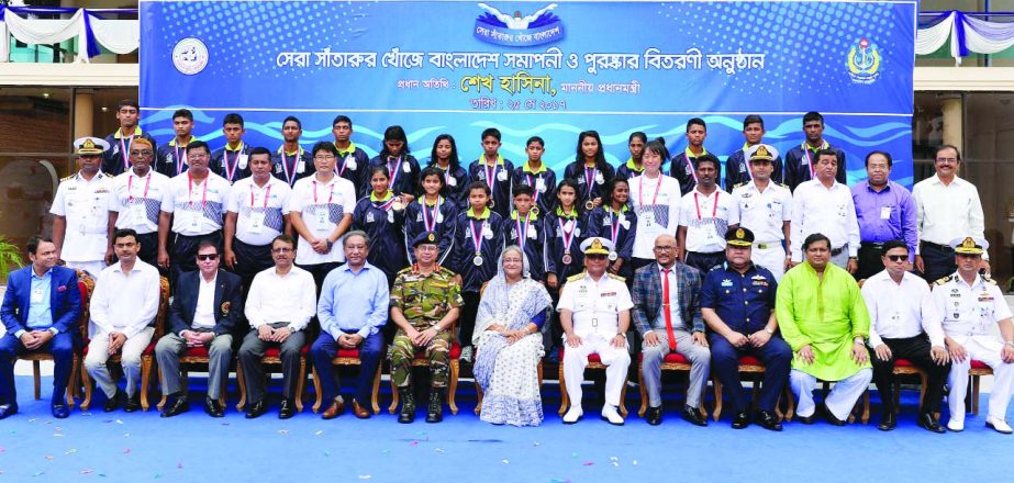 Prime Minister Sheikh Hasina poses for a photograph along with the award winners at the concluding ceremony of Swimming Talent Hunt titled 'Bangladesh in Quest of Best Swimmer' at the Navy Headquarters in the city on Thursday.