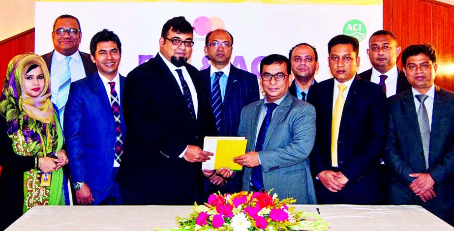 Nazeem A Choudhury, Head of Consumer Banking of Eastern Bank Ltd. (EBL) and Pradip Kar Chowdhury, Executive Director of ACI Ltd. exchanging documents after signing an agreement on EBL Commercial Payment Solutions (CPS), powered by MasterCard at the banks