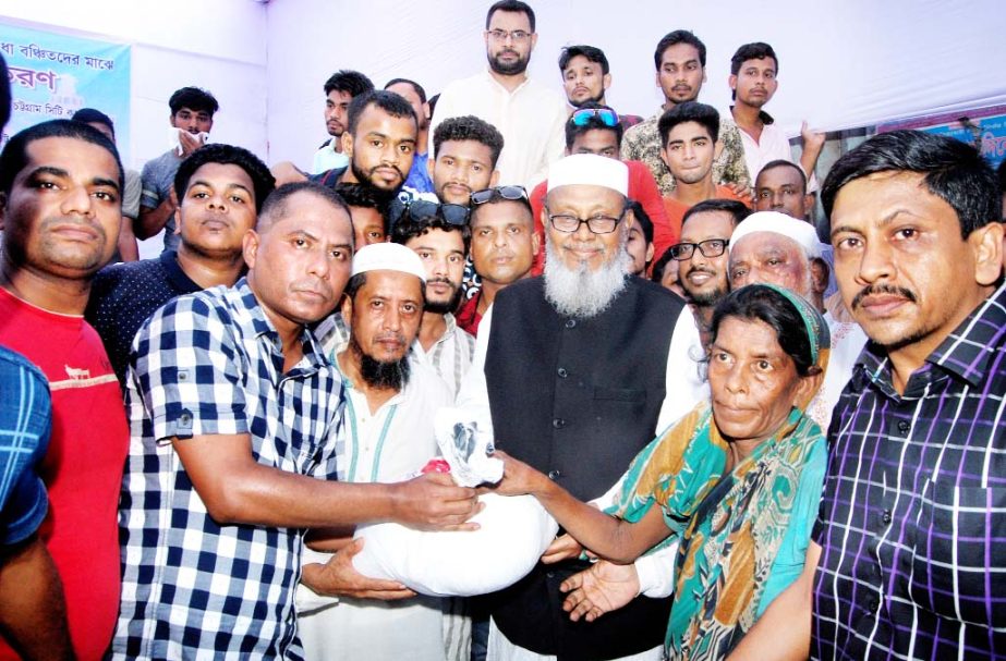 Former CCC Mayor and Chittagong City Awami League President Alhaj ABM Mohiuddin Chowdhury distributing iftar items on behalf of Chaktai Moholla and Samaj Kalyan Sangstha yesterday.