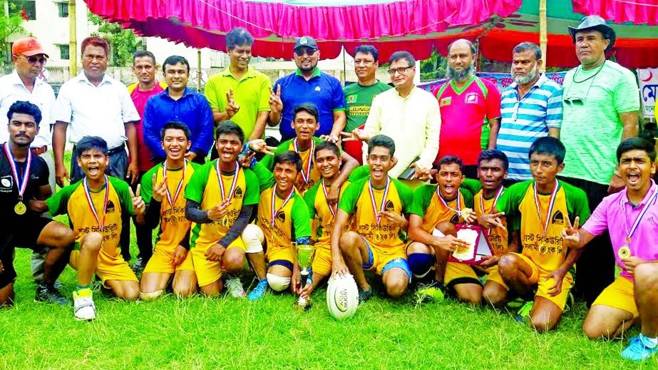 Members of Saint Gregory's High School, the champions of the First Security Islami Bank School Rugby Competition with the guests and officials of Bangladesh Rugby Federation pose for a photo session at Physical Education College Ground in the city's Moh