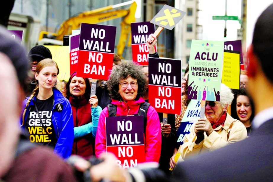 People protest President Donald Trump's travel ban outside of the US Court of Appeals in Seattle, Washington.