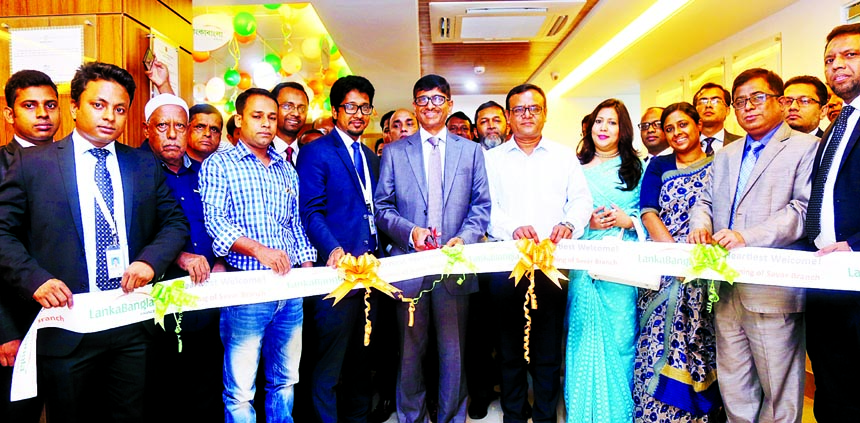 Khwaja Shahriar, Managing Director of LankaBangla Finance Limited, recently inaugurating its 24th branch at Shimoltola in Savar. Senior officials of the company and local elites among others were present.
