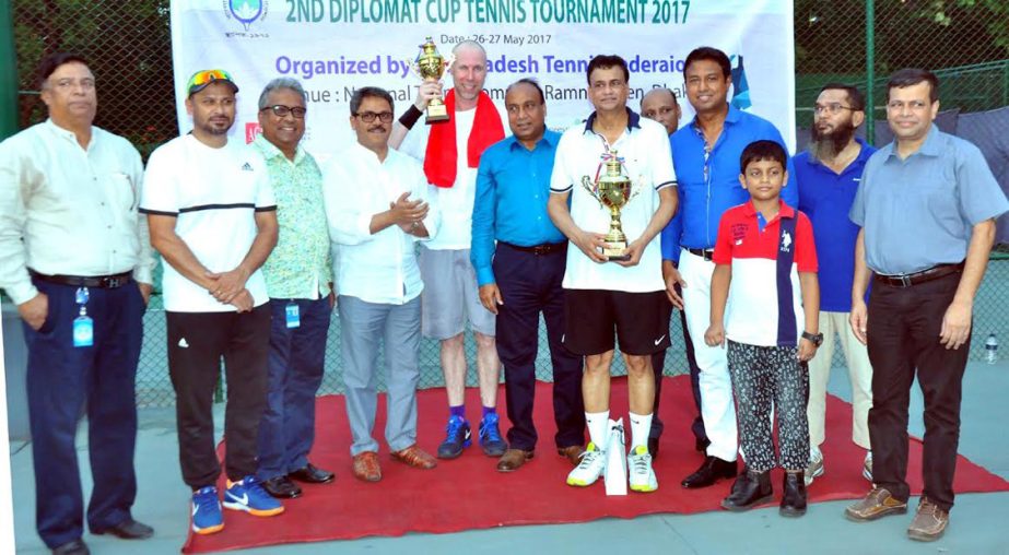 The winners of the Diplomat Cup Tennis Tournament with the chief guest State Minister for Foreign Affairs and President of Bangladesh Tennis Federation (BTF) Md Shahriar Alam and the other guests and officials of BTF pose for photograph at the National Te